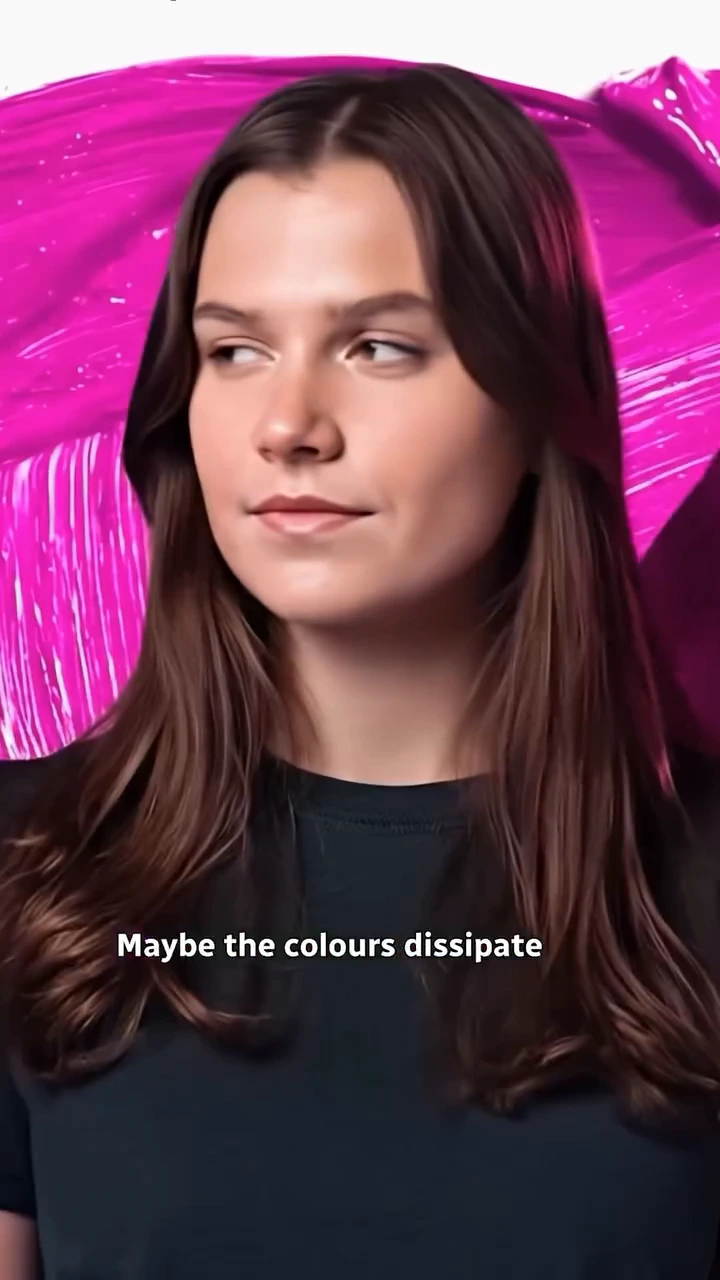 An AI sequence surrounds Maïa Schwinghammer with flowing bright-pink colour.