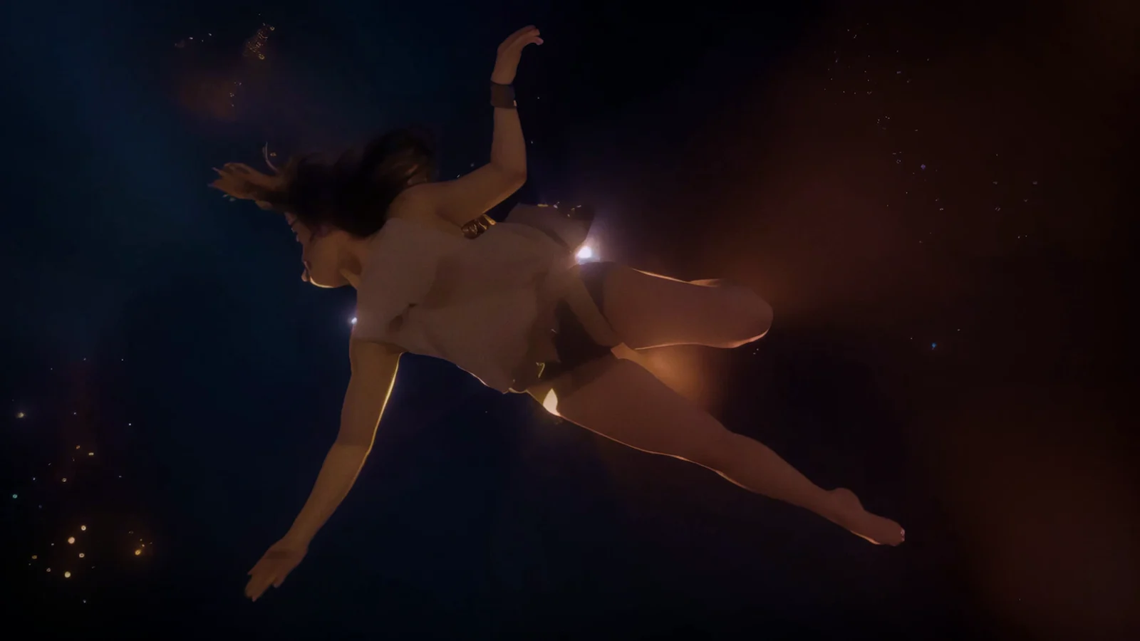 A woman reaches into a star-filled darkness as her body falls through space